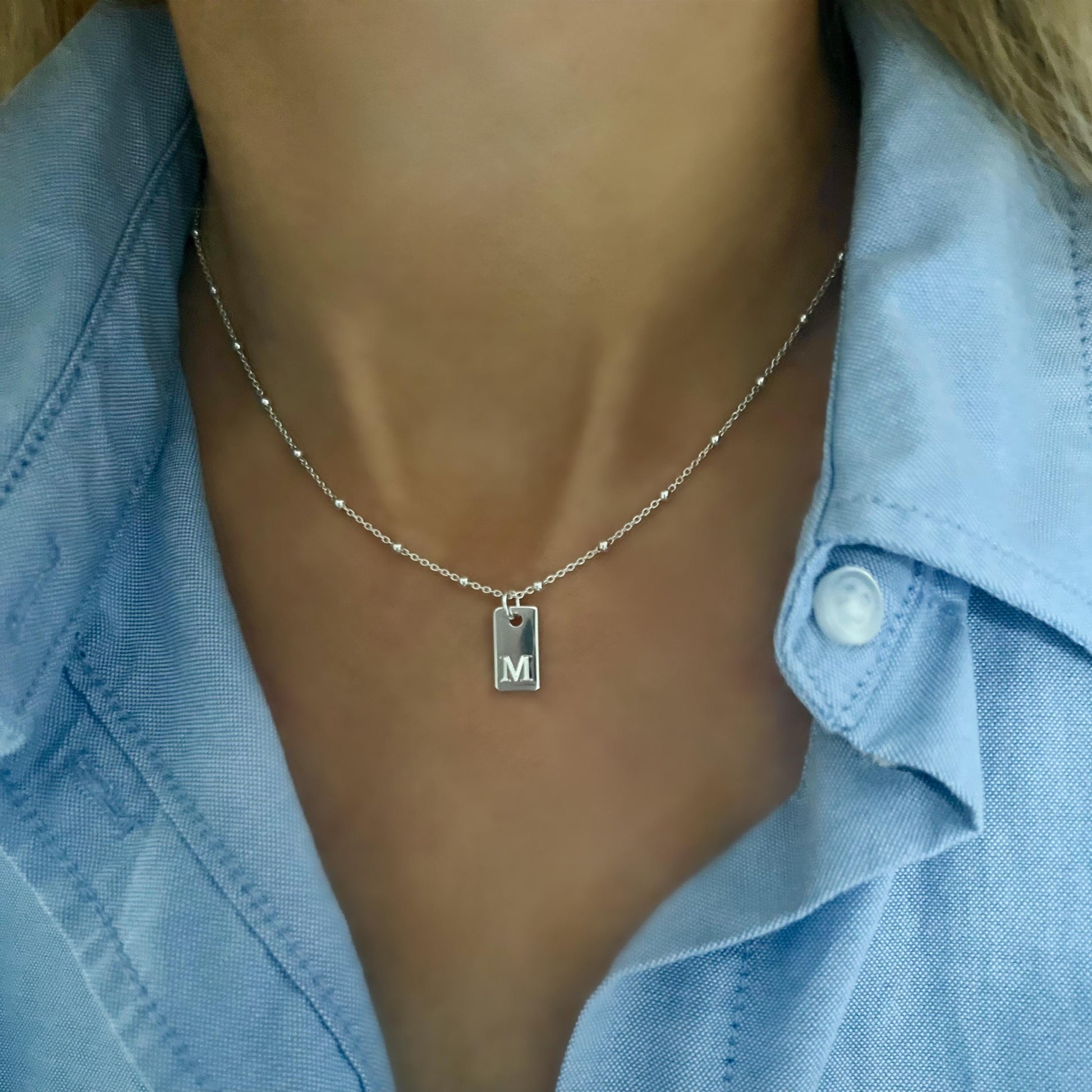 engraved initial tag necklace made with sterling silver